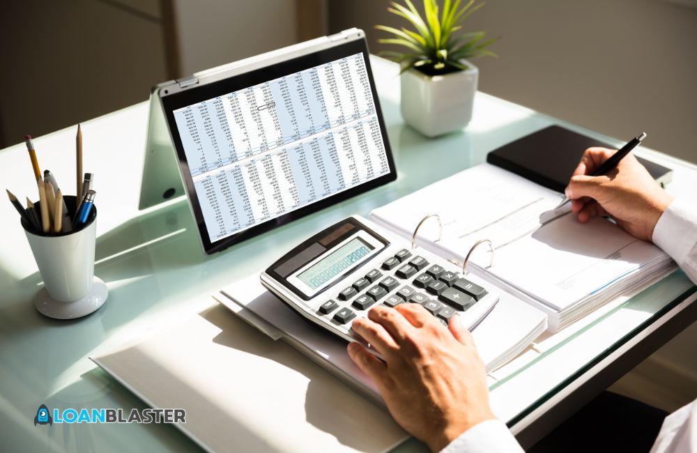 Businessman calculating invoice using calculator